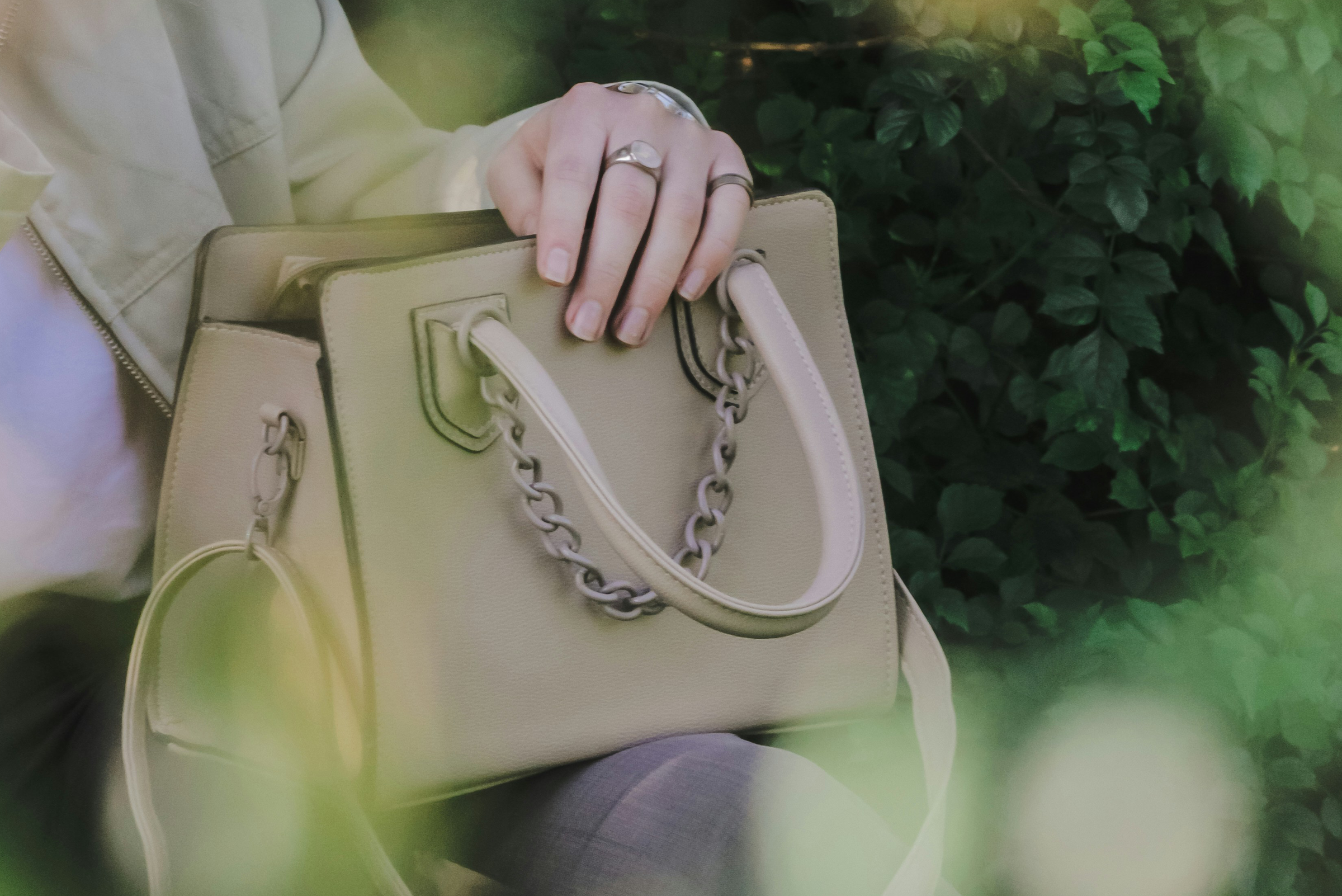 Close-up of a brown leather handbag zipper